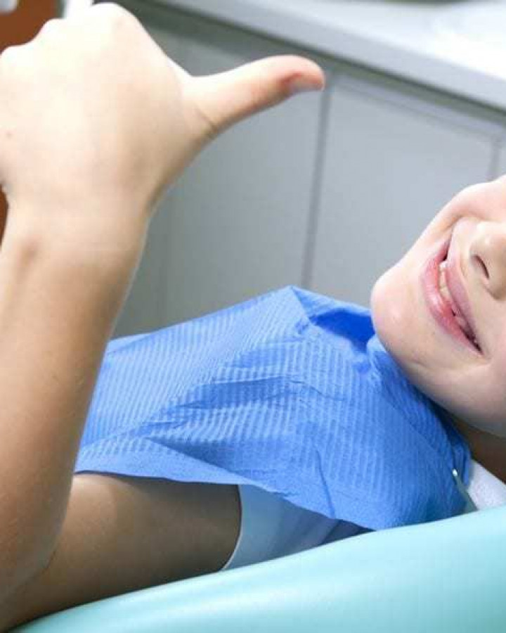 smiling bot with thumbs up sat in a dentist chair at orchard house northallerton
