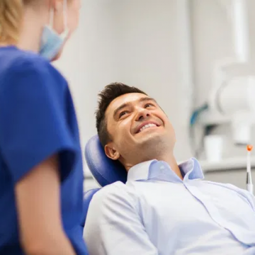man in a dental chair during a consultation